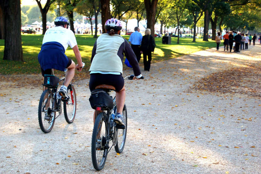 man and woman cycling