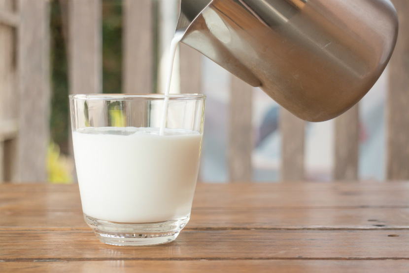 jug pouring a glass of milk