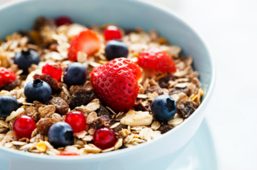 Bowl of cereal with fruit on top