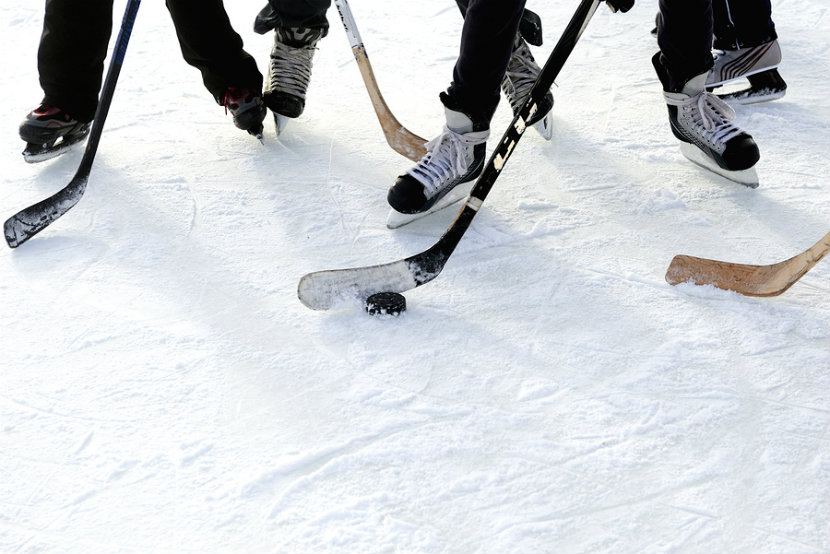 group of people playing hockey