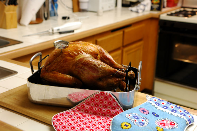 turkey being cooked with a thermometer in it