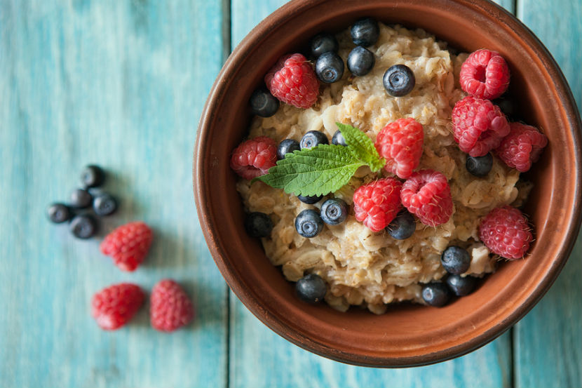 bowl of oatmeal with berries in it