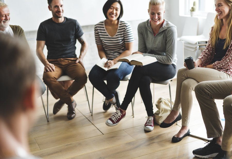 male and female students in a group seminar