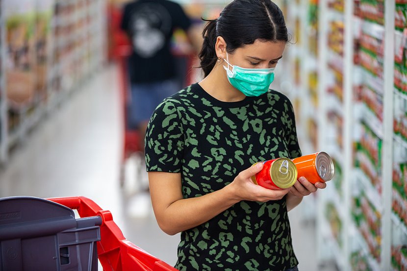 woman in a mask grocery shopping